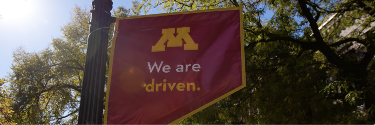 Photograph of a banner that reads "We are Driven"